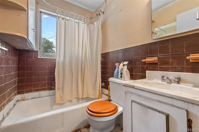 1665 S Madison St, Denver, CO 80210 - bathroom featuring tile walls, vanity, shower / bathtub combination with curtain, and wainscoting