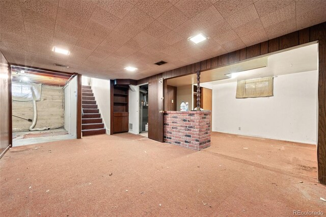 1665 S Madison St, Denver, CO 80210 - finished below grade area featuring stairway, wooden walls, and carpet