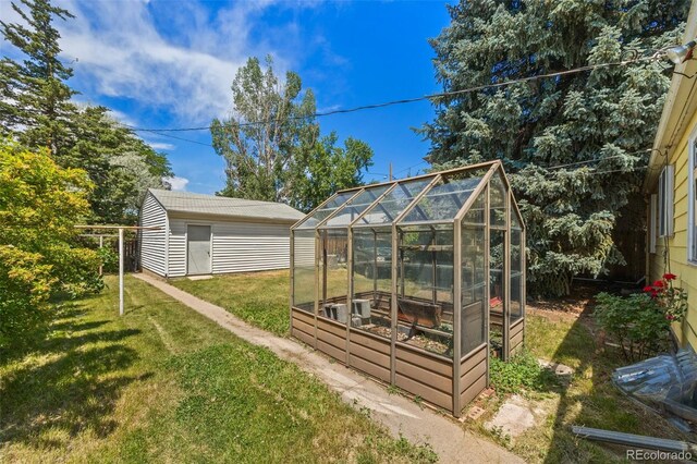 1665 S Madison St, Denver, CO 80210 - view of yard with an exterior structure and an outbuilding