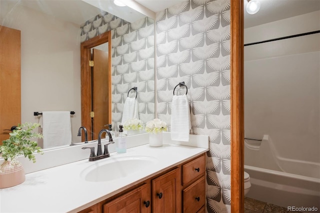 bathroom featuring toilet and vanity