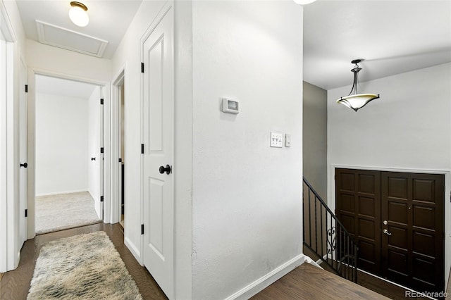 4604 Routt St, Wheat Ridge, CO 80033 - hallway featuring an upstairs landing and dark wood finished floors