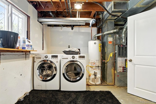 4604 Routt St, Wheat Ridge, CO 80033 - washroom with gas water heater, washer and clothes dryer, and heating unit