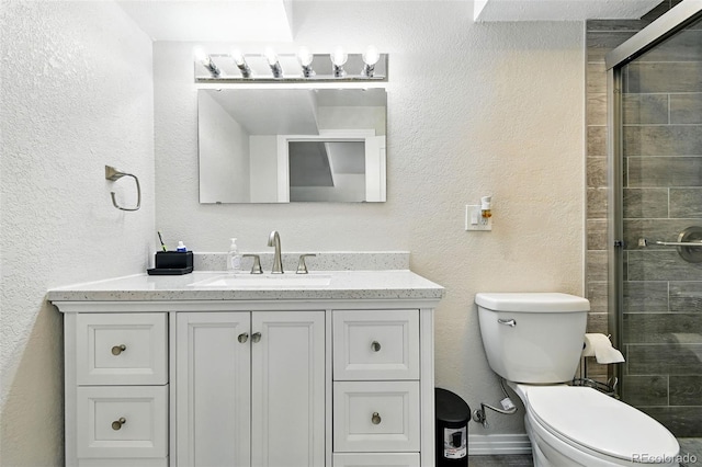 4604 Routt St, Wheat Ridge, CO 80033 - bathroom featuring a textured wall, vanity, and a stall shower