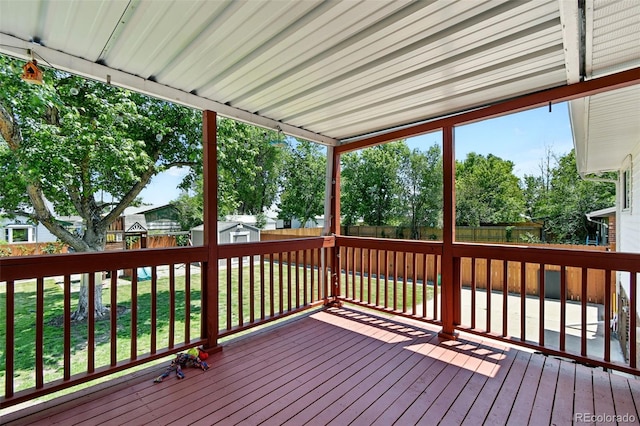 4604 Routt St, Wheat Ridge, CO 80033 - wooden terrace with a fenced backyard and a storage unit