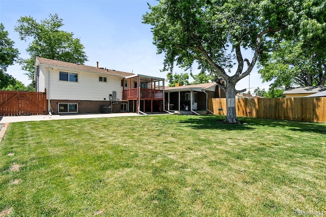 4604 Routt St, Wheat Ridge, CO 80033 - rear view of house with a fenced backyard and a gate
