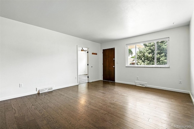 4604 Routt St, Wheat Ridge, CO 80033 - empty room with dark wood finished floors and baseboards