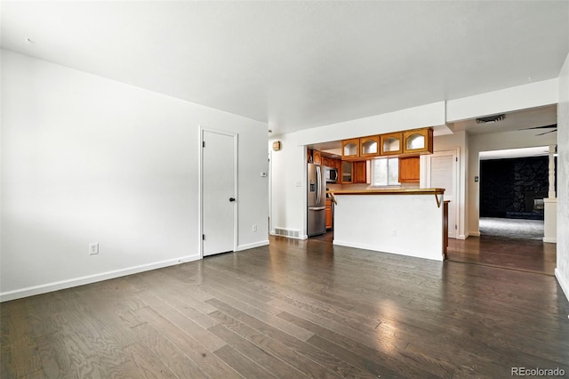 4604 Routt St, Wheat Ridge, CO 80033 - unfurnished living room with dark wood finished floors and baseboards