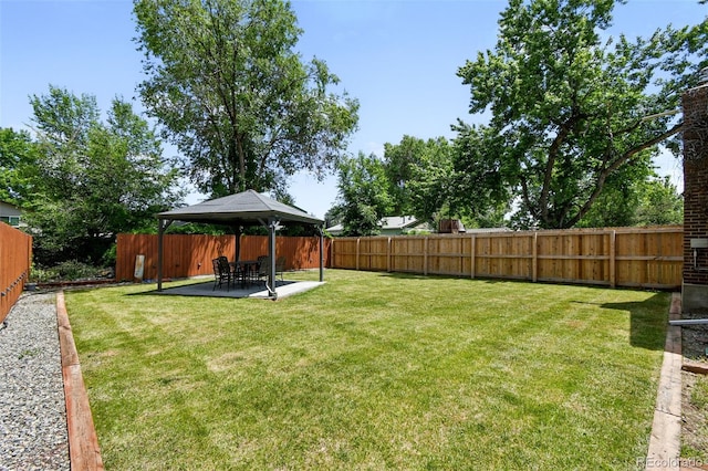 4604 Routt St, Wheat Ridge, CO 80033 - fenced backyard featuring a gazebo and a patio