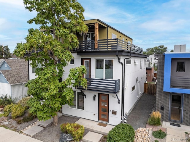 3932 Utica St, Denver, CO 80212 - modern home with stucco siding and a balcony