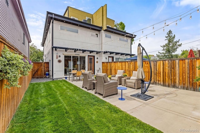 3932 Utica St, Denver, CO 80212 - back of house featuring a yard, outdoor lounge area, a patio area, stucco siding, and a fenced backyard