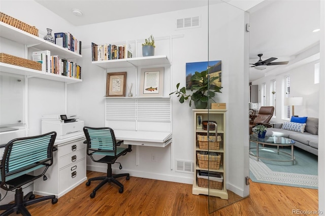 3932 Utica St, Denver, CO 80212 - home office with built in desk, visible vents, wood finished floors, and a ceiling fan