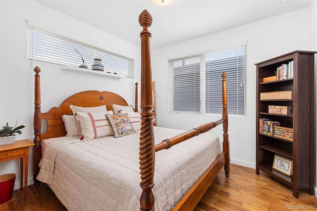 3932 Utica St, Denver, CO 80212 - bedroom featuring baseboards, multiple windows, and wood finished floors