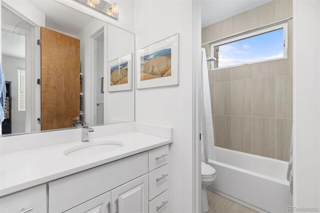 3932 Utica St, Denver, CO 80212 - full bath featuring shower / bath combo with shower curtain, toilet, and vanity