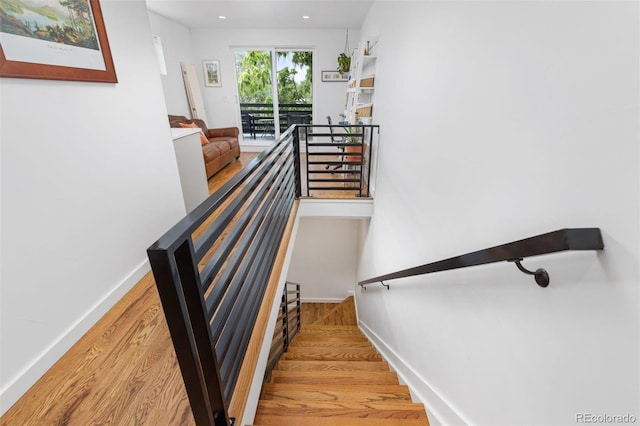 3932 Utica St, Denver, CO 80212 - stairway with baseboards and wood finished floors