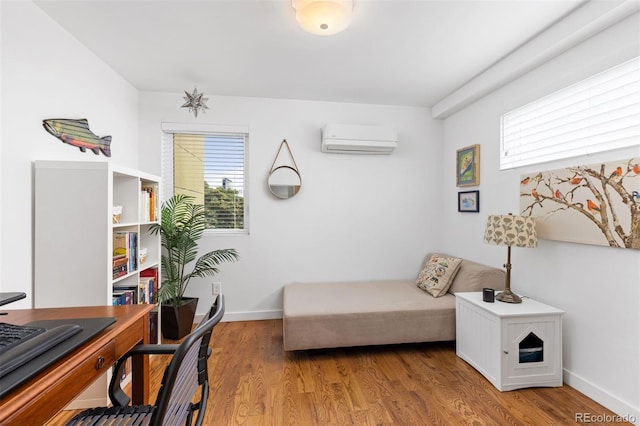 3932 Utica St, Denver, CO 80212 - office with light wood-style floors, baseboards, and a wall mounted AC