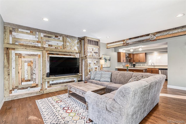 living room with wood-type flooring and sink