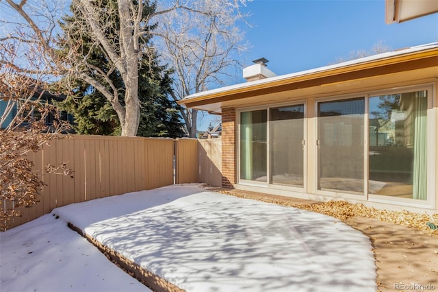 wooden terrace featuring a fenced backyard