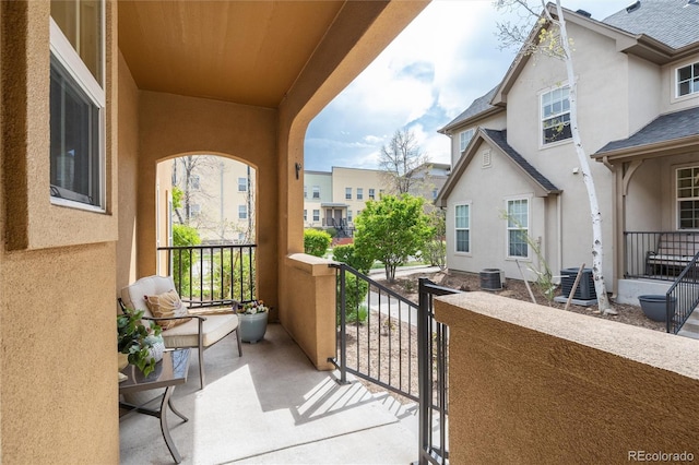balcony with covered porch and cooling unit