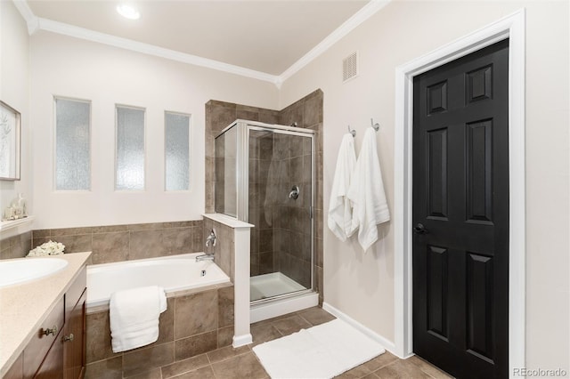 bathroom with visible vents, a garden tub, vanity, and a shower stall