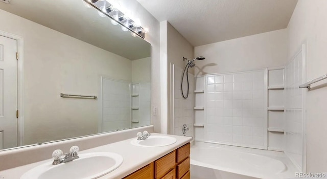 bathroom featuring shower / bath combination and vanity