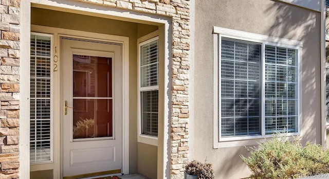 10165 E Carolina Pl Unit 102, Aurora, CO 80247 - entrance to property featuring stone siding and stucco siding