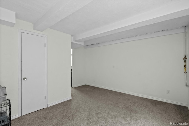 finished below grade area featuring carpet floors and baseboards