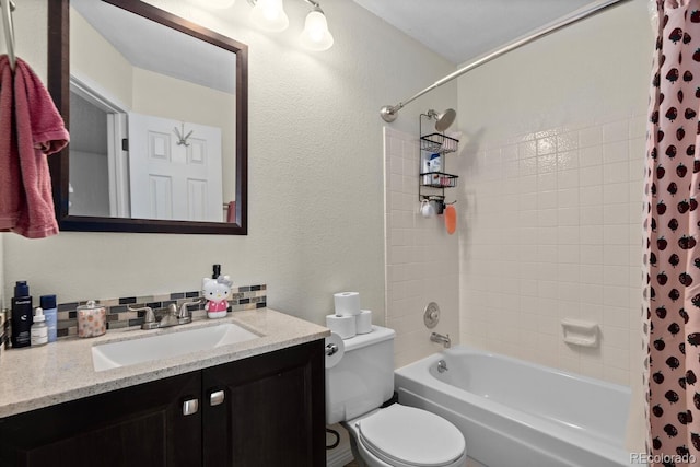 bathroom with toilet, vanity, shower / tub combo with curtain, and a textured wall