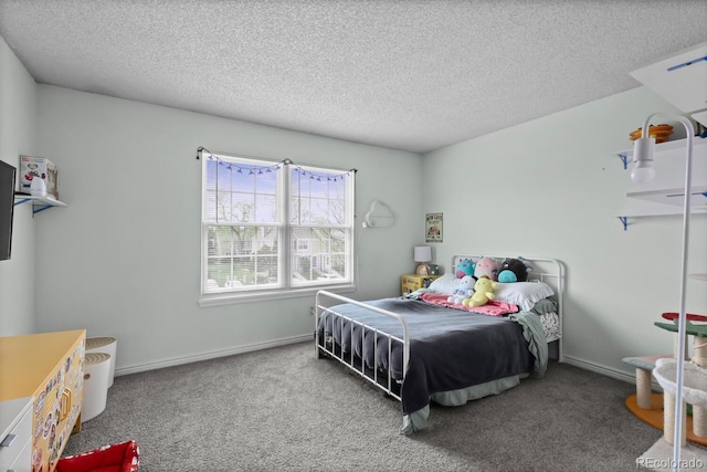 bedroom featuring carpet, a textured ceiling, and baseboards