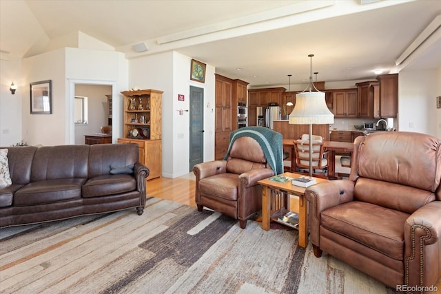 living room with light hardwood / wood-style flooring