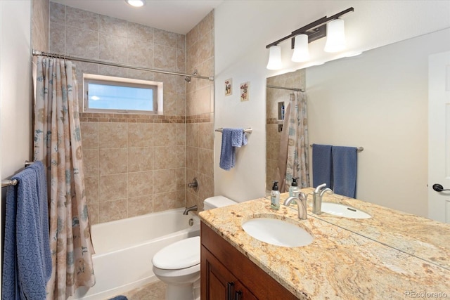 full bathroom featuring shower / tub combo with curtain, vanity, and toilet