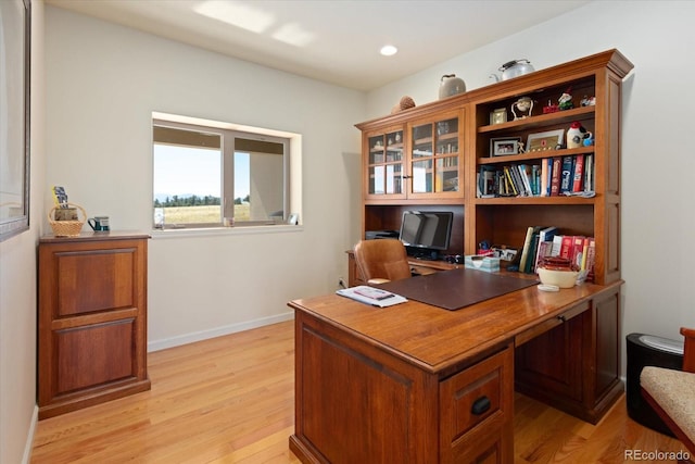 office space with light hardwood / wood-style floors