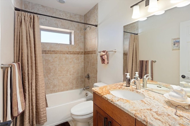 full bathroom with shower / bathtub combination with curtain, vanity, and toilet