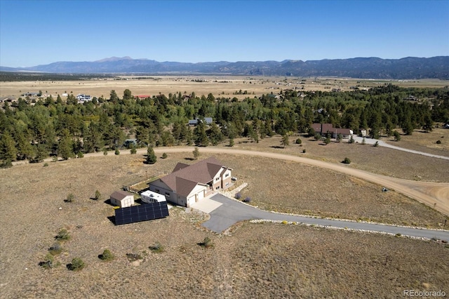 drone / aerial view with a rural view and a mountain view