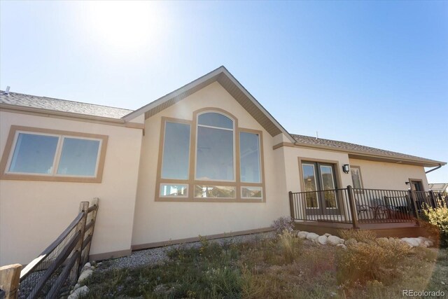 exterior space featuring a wooden deck