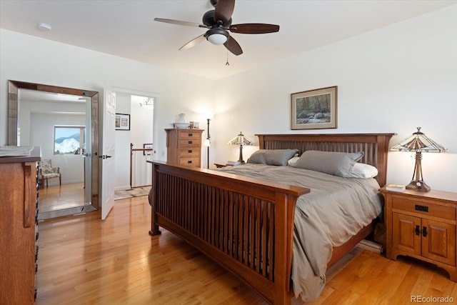 bedroom with ceiling fan and light hardwood / wood-style flooring