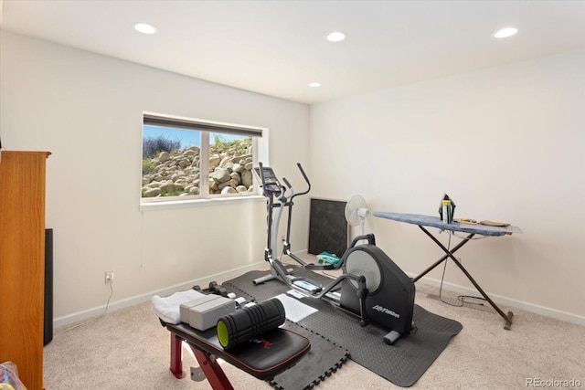 workout room featuring light colored carpet