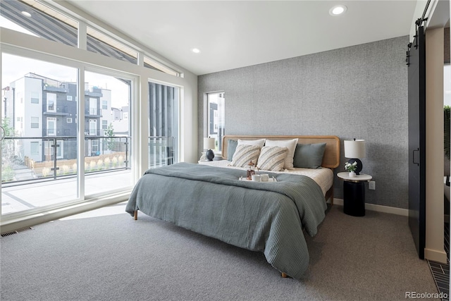 4823 W 10th Ave, Denver, CO 80204 - carpeted bedroom with lofted ceiling, recessed lighting, a barn door, and access to outside