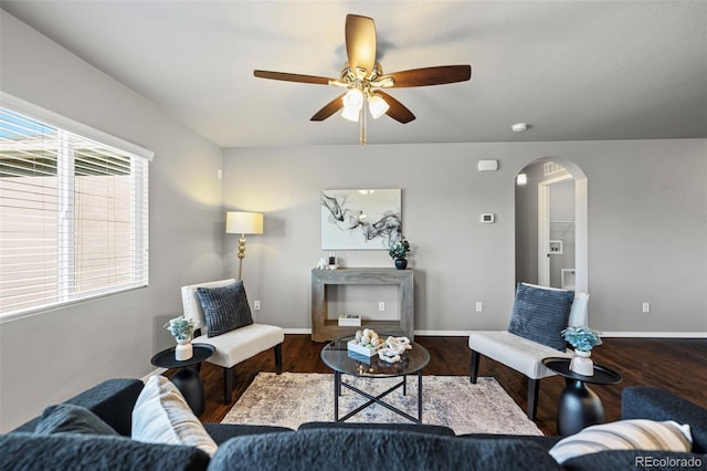 living room featuring ceiling fan and hardwood / wood-style floors