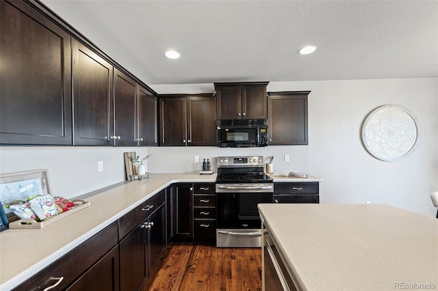 kitchen featuring dark brown cabinets, a textured ceiling, dark hardwood / wood-style flooring, and stainless steel range with electric stovetop