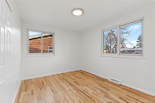 empty room with light hardwood / wood-style floors