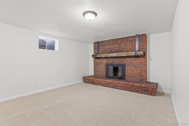 unfurnished living room with carpet and a brick fireplace