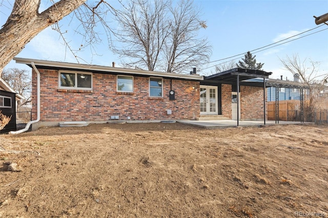 rear view of property with a patio and french doors