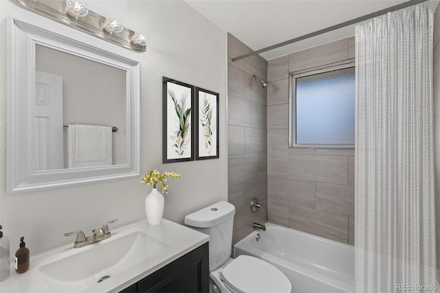 full bathroom featuring toilet, vanity, and shower / tub combo with curtain