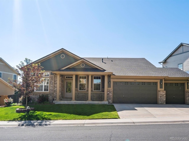 3853 S Malta St, Aurora, CO 80013 - view of front of property featuring an attached garage, a front lawn, concrete driveway, brick siding, and covered porch
