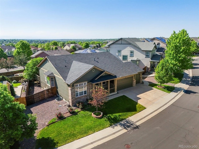 3853 S Malta St, Aurora, CO 80013 - view of front of home with a residential view, an attached garage, concrete driveway, roof with shingles, and stone siding