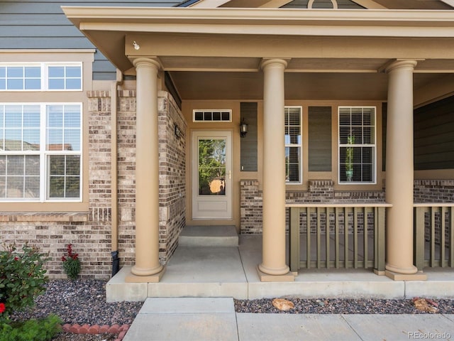3853 S Malta St, Aurora, CO 80013 - entrance to property with a porch and brick siding