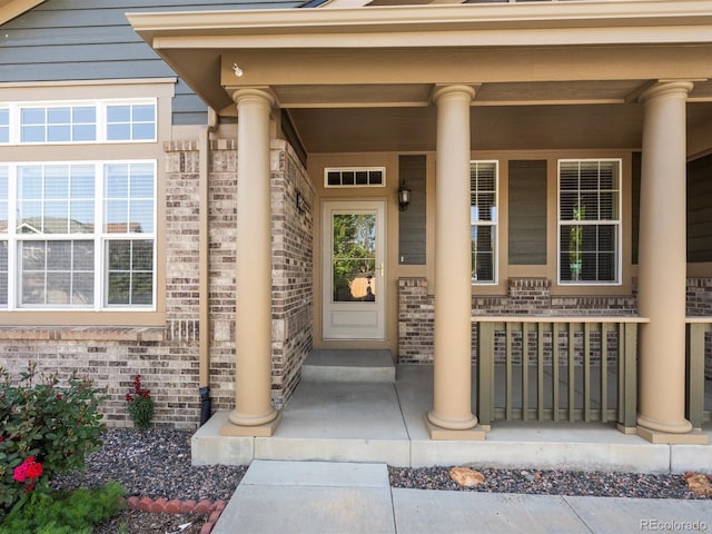 3853 S Malta St, Aurora, CO 80013 - view of exterior entry with covered porch and brick siding