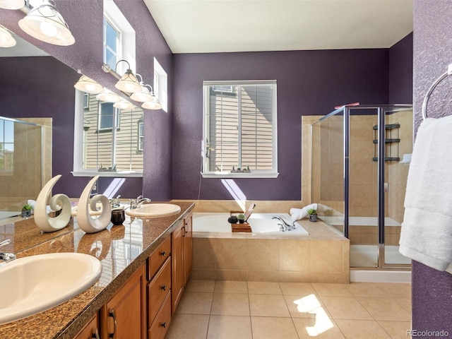 3853 S Malta St, Aurora, CO 80013 - bathroom with a garden tub, tile patterned floors, a shower stall, and double vanity