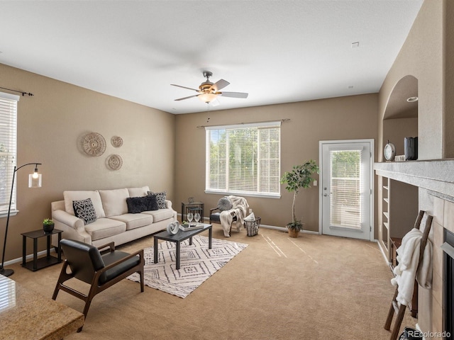 3853 S Malta St, Aurora, CO 80013 - living room featuring a fireplace, ceiling fan, carpet floors, and baseboards
