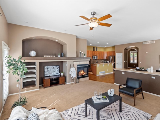 3853 S Malta St, Aurora, CO 80013 - living room with ceiling fan, light carpet, a fireplace, baseboards, and recessed lighting